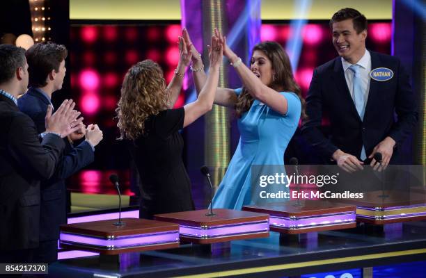 Faith Evans vs Ross Mathews and USA Gymnastics vs USA Swimming" - The celebrity teams competing to win cash for their charities feature the families...