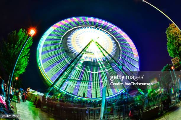 minnesota state fair - ferris wheel spinning at night - neon joe stock pictures, royalty-free photos & images