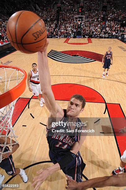 Brook Lopez of the New Jersey Nets slam dunks during a game against the Portland Trail Blazers on March 13, 2009 at the Rose Garden Arena in...