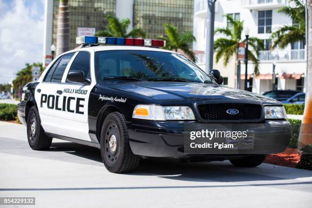 police car and sirens parked in miami florida usa - cop car imagens e fotografias de stock