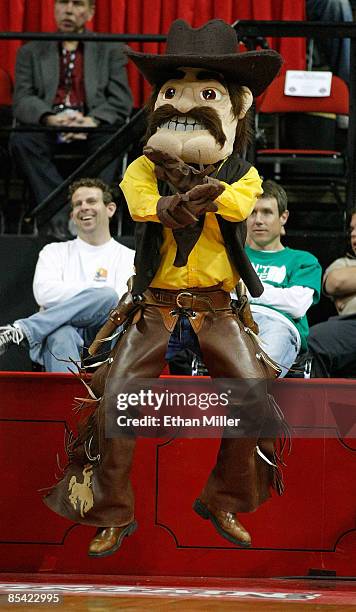 Wyoming Cowboys mascot "Pistol Pete" jumps in the air during a semifinal game against the Utah Utes during a semifinal game of the Conoco Mountain...