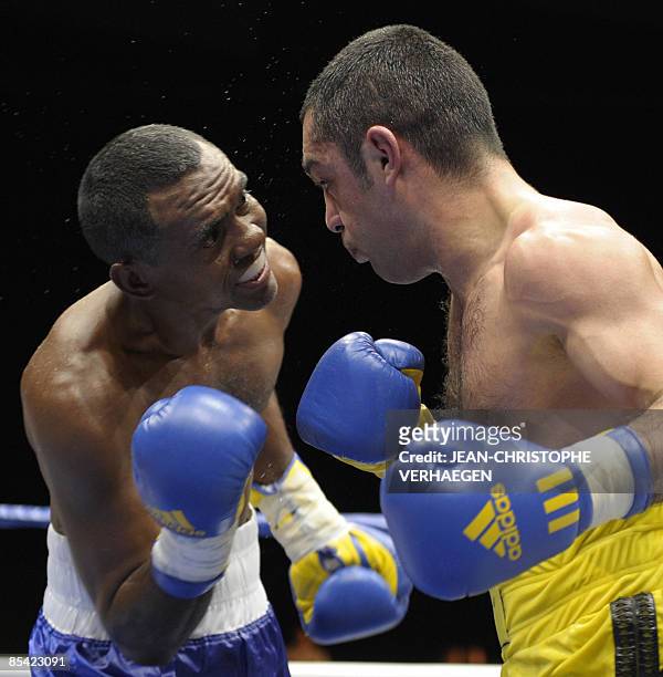 French former super-bantamweight WBA champion Mahyar Monshipour fights against Venezuelian Felix Machado during their super-bantamweight boxing...