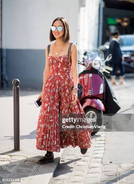 Aimee Song is seen outside Dior during Paris Fashion Week Spring/Summer 2018 on September 26, 2017 in Paris, France.