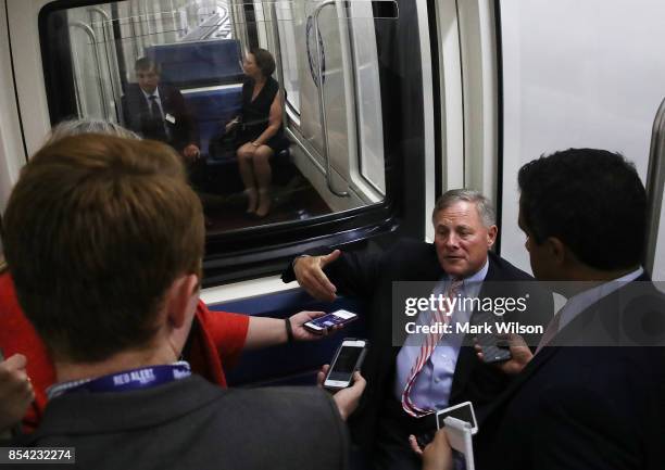 Senate Intelligence Committee Chairman Richard Burr speaks to reporters while riding the Senate Subway before attending a closed door committee...