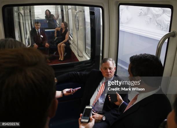 Senate Intelligence Committee Chairman Richard Burr speaks to reporters while riding the Senate Subway before attending a closed door committee...