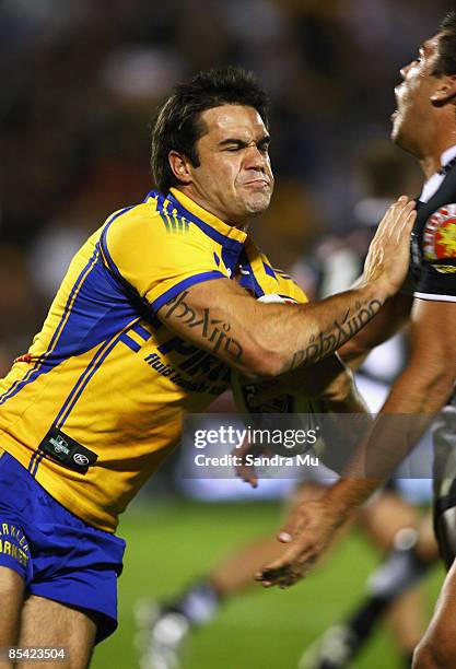 Eric Grothe of the Eels fends off the Warriors defence during the round one NRL match between the Warriors and the Parramatta Eels at Mt Smart...