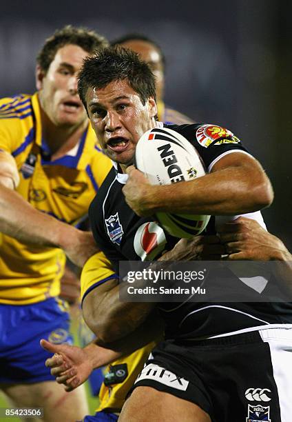 Joel Moon of the Warriors is tackled during the round one NRL match between the Warriors and the Parramatta Eels at Mt Smart Stadium on March 14,...