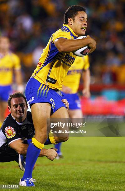 Lance Hohaia of the Warriors makes a tackle on Jarryd Hayne of the Eels during the round one NRL match between the Warriors and the Parramatta Eels...