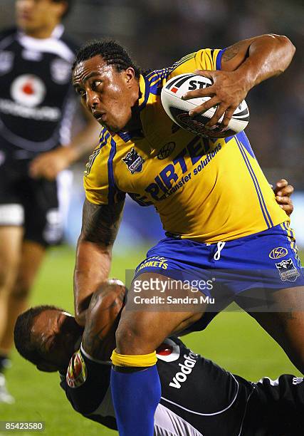 Fuifui Moimoi of the Eels fends off Manu Vatuvei of the Warriors during the round one NRL match between the Warriors and the Parramatta Eels at Mt...
