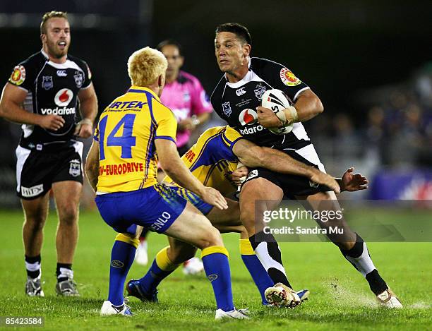 Steve Price of the Warriors is tackled during the round one NRL match between the Warriors and the Parramatta Eels at Mt Smart Stadium on March 14,...