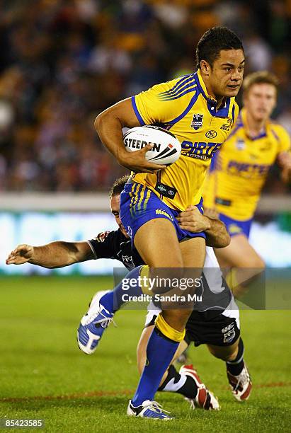 Lance Hohaia of the Warriors makes a tackle on Jarryd Hayne of the Eels during the round one NRL match between the Warriors and the Parramatta Eels...