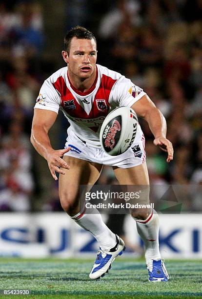 Dean Young of the Dragons offloads the ball during the round one NRL match between the Melbourne Storm and the St George Illawarra Dragons at Olympic...