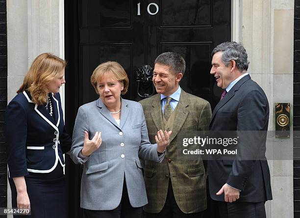 British Prime Minister Gordon Brown and his wife Sarah Brown stand outside number 10 Downing Street with German Chancellor Angela Merkel and her...