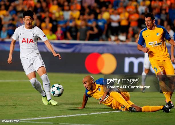 Tottenham Hotspur's South Korean striker Son Heung-min runs after the ball as APOEL FC's Brazilian defender Carlao looks on during the UEFA Champions...