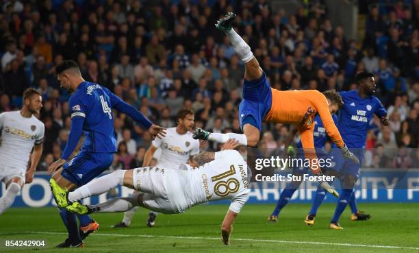 Leeds goalkeeper Felix Wiedwald catches his own player Pontus Jansson whilst clearing a corner during the Sky Bet Championship match between Cardiff...