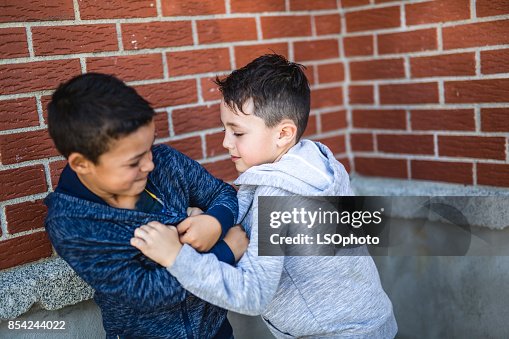Two Boys Fighting In Playground Two Boys Fighting In Playground