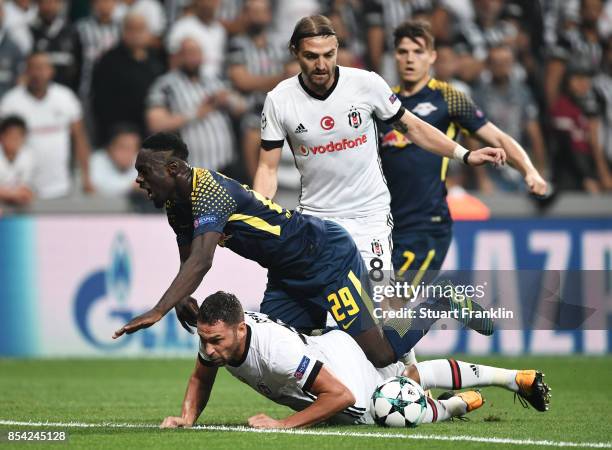 Dusko Tosic of Besiktas tackles Jean-Kevin Augustin of RB Leipzig during the UEFA Champions League Group G match between Besiktas and RB Leipzig at...