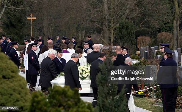 Mourners follow the coffin during the funeral of one of the victims of a high school shooting on March 14, 2009 in Winnenden, Germany. 17 - year old...
