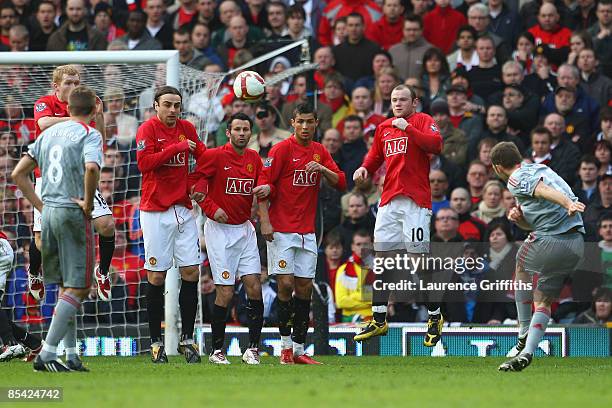 Fabio Aurelio of Liverpool scores his team's third goal during the Barclays Premier League match between Manchester United and Liverpool at Old...
