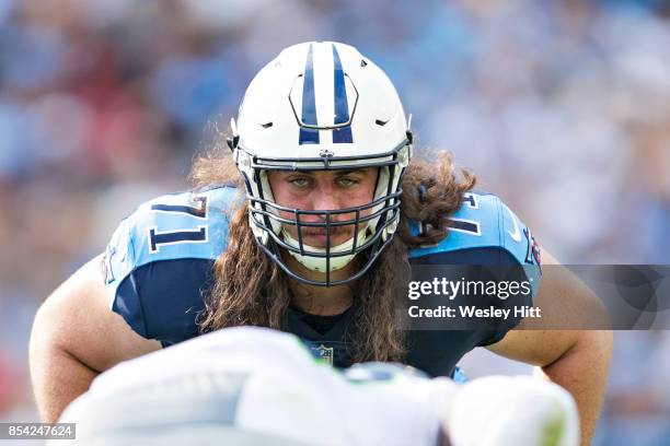 Dennis Kelly of the Tennessee Titans prepares to block on a extra point kick during a game against the Seattle Seahawks at Nissan Stadium on...