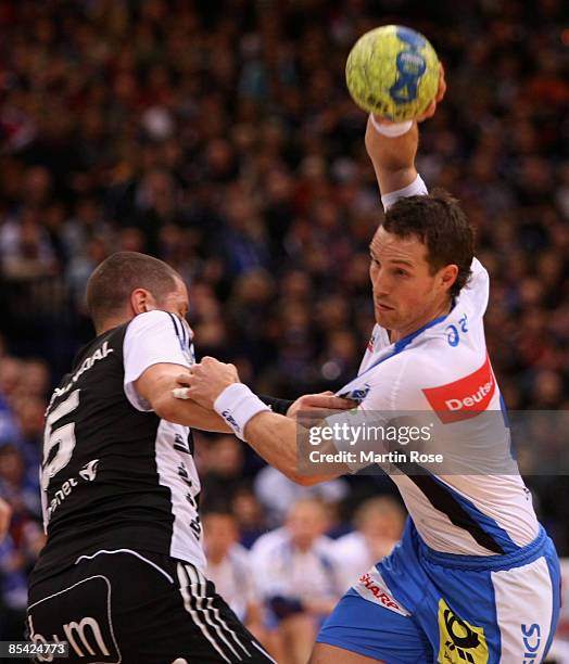 Torsten Jansen of Hamburg and Kim Andersson of Kiel compete for the ball during the Bundesliga match between HSV Hamburg and THW Kiel at the Color...
