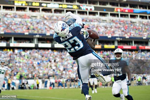 Brice McCain of the Tennessee Titans knocks away a pass thrown into the end zone to Paul Richardson of the Seattle Seahawks at Nissan Stadium on...