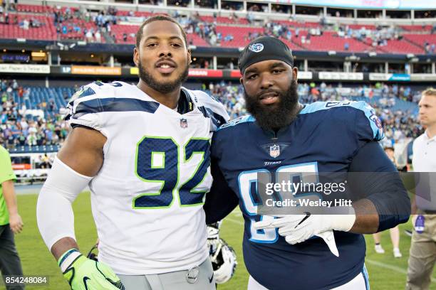 Sylvester Williams of the Tennessee Titans posses after a game with Nazair Jones of the Seattle Seahawks at Nissan Stadium on September 24, 2017 in...