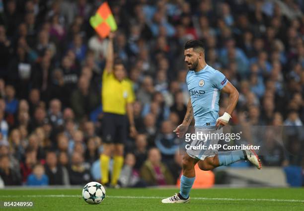 Manchester City's Argentinian striker Sergio Aguero runs with the ball towards goal but is ruled off-side during the Group F football match between...