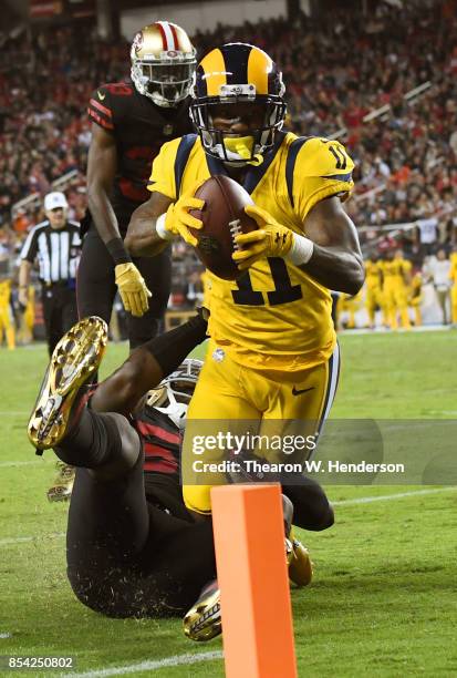 Tavon Austin of the Los Angeles Rams gets tackles at the one yard line by Ray-Ray Armstrong of the San Francisco 49ers during their NFL football game...