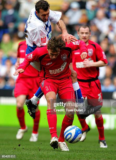 Luciano Civelli of Ipswich Town is challenged by Glen Little of Reading during the Coca-Cola Championship match between Reading and Ipswich Town at...