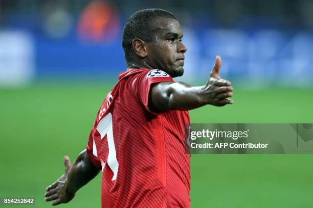 Spartak Moscow's midfielder from Brazil Fernando celebrates after scoring a goal during the UEFA Champions League Group E football match between FC...