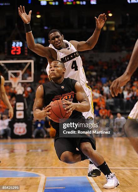 Byron Eaton of the Oklahoma State Cowboys during the Phillips 66 Big 12 Men's Basketball Championship Semifinals at the Ford Center March 13, 2009 in...