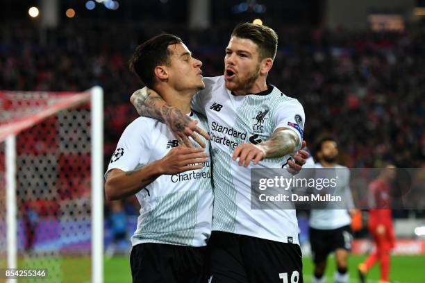 Philippe Coutinho of Liverpool celebrates scoring his sides first goal with Alberto Moreno of Liverpool during the UEFA Champions League group E...