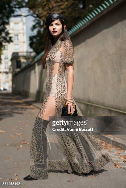 Doina Ciobanu poses wearing Dior after the Dior show at the Musee Rodin during Paris Fashion Week Womenswear SS18 on September 26, 2017 in Paris,...