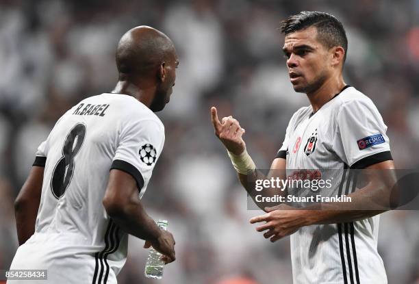 Pepe of Besiktas speaks to Ryan Babel of Besiktas during the UEFA Champions League Group G match between Besiktas and RB Leipzig at Besiktas Park on...