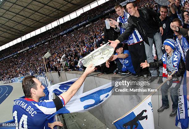 Josip Simunic of Berlin and supporters are seen after the Bundesliga match between Hertha BSC Berlin and Bayer 04 Leverkusen at the Olympic stadium...