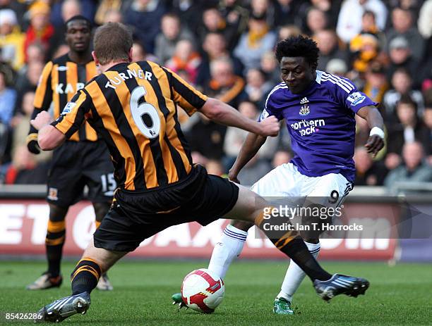 Obafemi Martins takes on Micheal Turner during the Barclays Premier League game between Hull City and Newcastle United at the KC Stadium, on March...