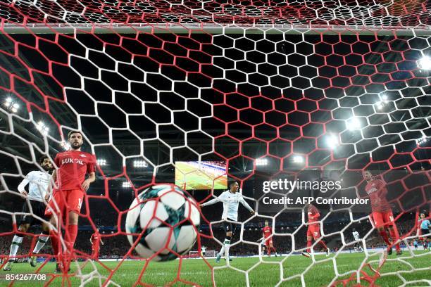 Liverpool's forward from Brazil Roberto Firmino celebrates a goal scored by Liverpool's midfielder from Brazil Philippe Coutinho Correia during the...