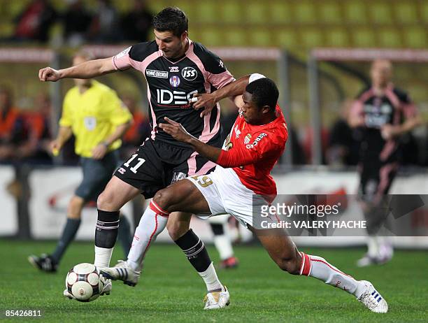 Monaco's midfielder Jean Jacques Gosso vies with Toulouse's forward Andre Pierre Gignac during their French L1 football match Monaco vs .Toulouse, on...