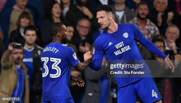 Goalscorer Junior Hoilett is congratulated by Sean Morrison after the second goal during the Sky Bet Championship match between Cardiff City and...