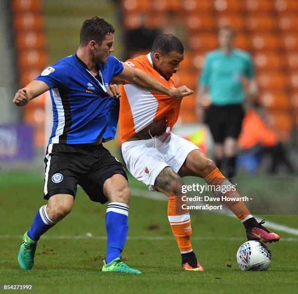 Blackpool's Kyle Vassell battles with Rochdale's Harrison McGahey during the Sky Bet League One match between Blackpool and Rochdale at Bloomfield...