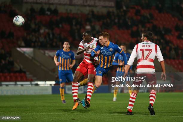 Rodney Kongolo of Doncaster Rovers and Joe Nolan of Shrewsbury Town during the Sky Bet League One match between Doncaster Rovers and Shrewsbury Town...