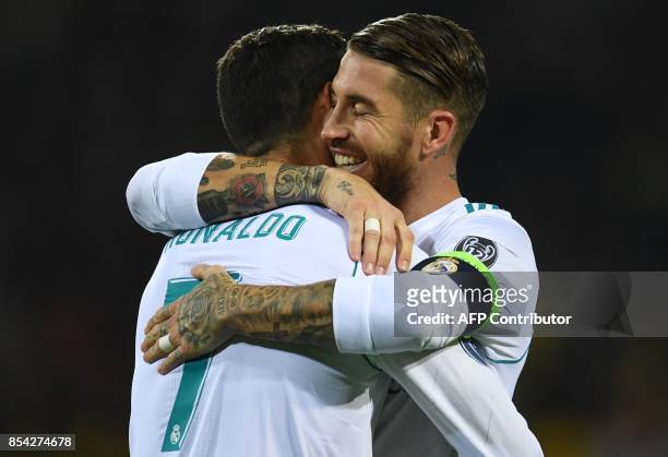 Real Madrid's forward from Portugal Cristiano Ronaldo celebrates scoring with Real Madrid's defender from Spain Sergio Ramos during the UEFA...
