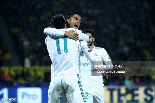 Cristiano Ronaldo of Real Madrid celebrates scoring his sides second goal with Gareth Bale of Real Madrid during the UEFA Champions League group H...
