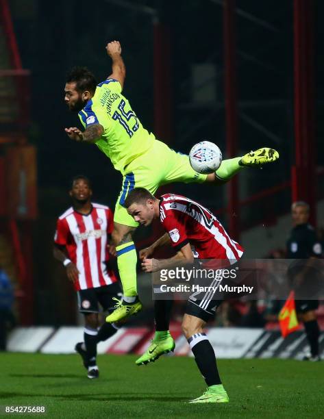Henrik Dalsgaard of Brentford and Bradley Johnson of Derby County battle for possession during the Sky Bet Championship match between Brentford and...