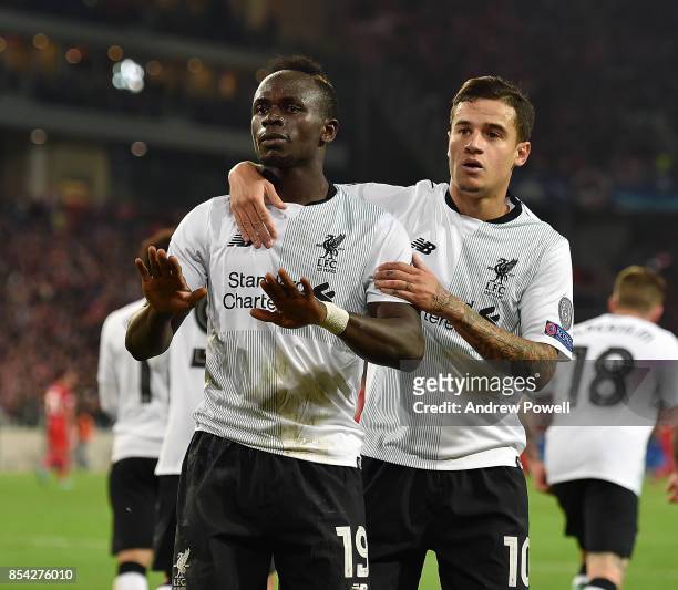 Philippe Coutinho and Sadio Mane of Liverpool celebrate after Philippe Coutinho scores a goal during the UEFA Champions League group E match between...