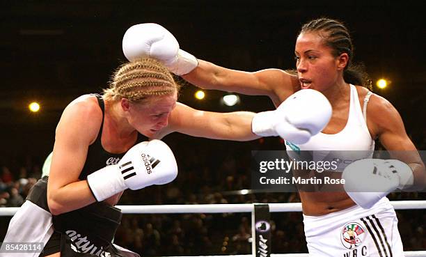 Cecilia Braekhus of Norway and Vinni Skovgaard of Denmark in action during the WBA/WBC World Championship fight between Cecilia Braekhus and Vinni...