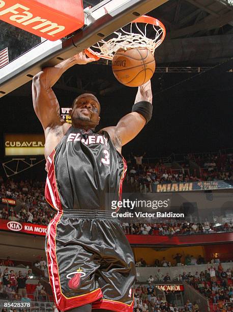 Dwyane Wade of the Miami Heat dunks against the Utah Jazz on March 14, 2009 at the American Airlines Arena in Miami, Florida. NOTE TO USER: User...