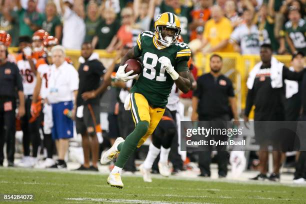 Geronimo Allison of the Green Bay Packers runs with the ball in overtime against the Cincinnati Bengals at Lambeau Field on September 24, 2017 in...