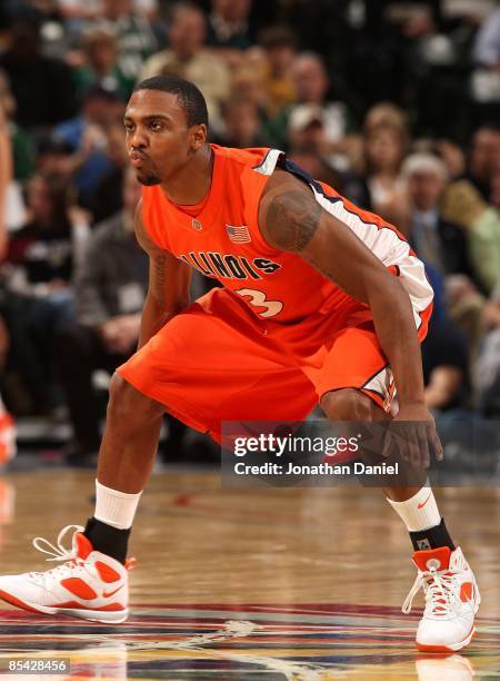 Jeff Jordan of the Illinois Fighting Illini defends against the Purdue Boilermakers during their semifinal game of the Big Ten Men's Basketball...